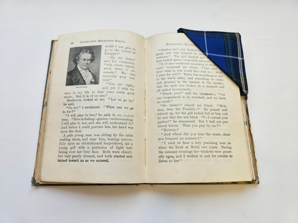 old school reader with story about Mozart with Nova Scotia tartan book marks