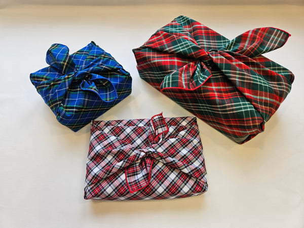 Christmas packages wrapped with tartan upcycled fabric wrapping cloth