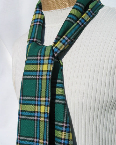 Green plaid scarf on a mannequin with a white background