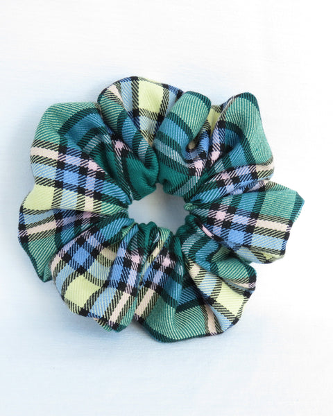 Alberta tartan Plaid patterned scrunchies on a white background
