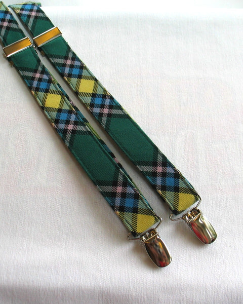 Green plaid alberta tartan suspenders with gold accents on a white background