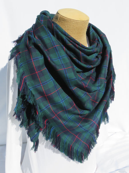 Navy and green plaid blanket scarf on maneguin torso