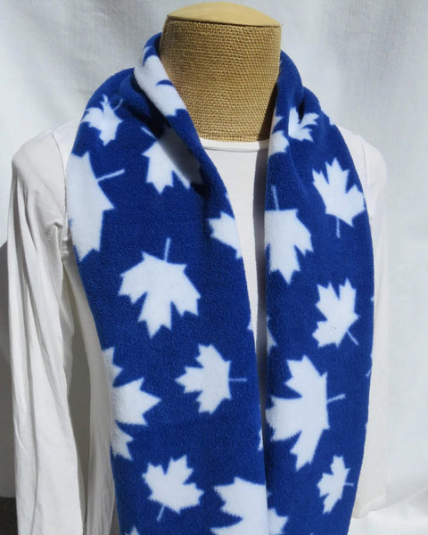 Royal blue scarf with white leaf pattern on a mannequin against a white background