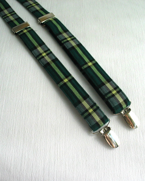 Green plaid cape breton tartan suspenders with silver clips on a white background