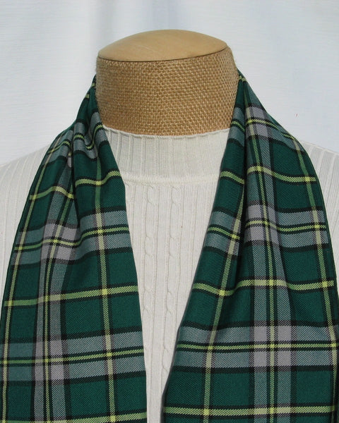 Green plaid Cape Breton tartan scarf draped over a mannequin with a white background