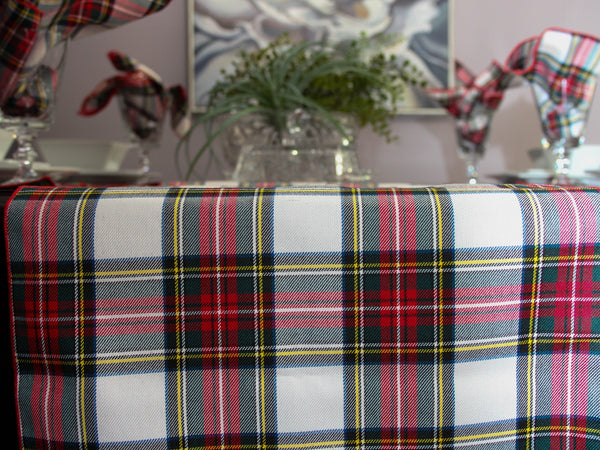 Plaid tablecloth on a table with decorative elements in the background