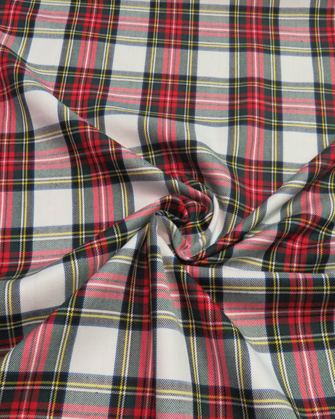 White, red and yellow plaid fabric scrunched. Dress Stewart tartan fabric by Taylors Tartans