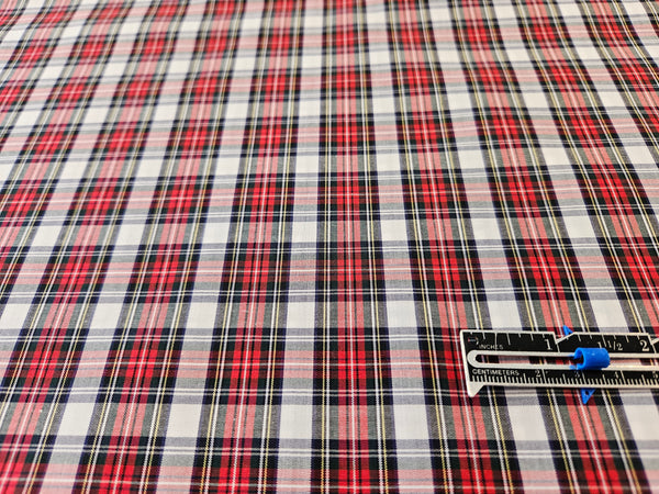 white, red and black cotton fabric with a ruller for sizing in Dress Stewart tartan