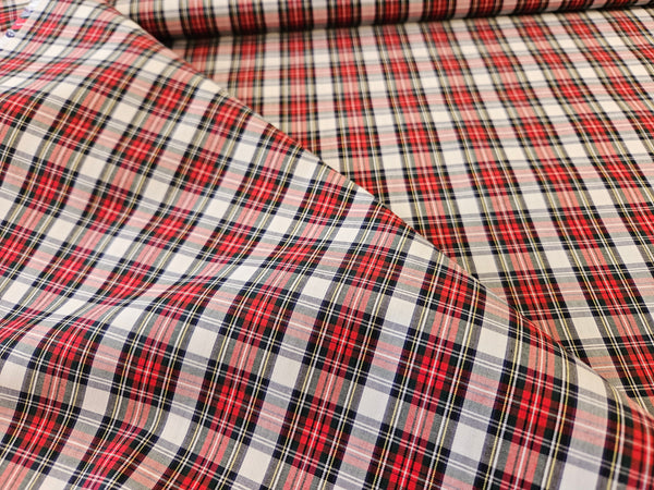 white and red plaid cotton fabric folded over itself sold by Taylors Tartans