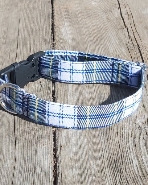 White and green plaid dog collar on a wooden surface Gordon tartan - Taylors Tartans