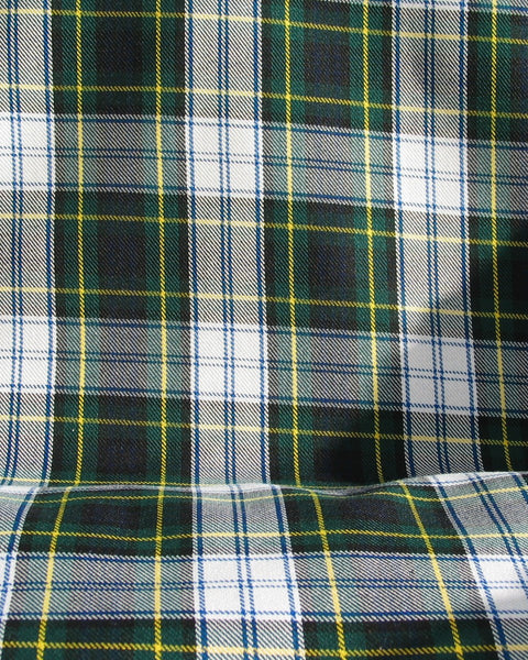 Close-up of green, white, and yellow plaid fabric in Gordon tartan material