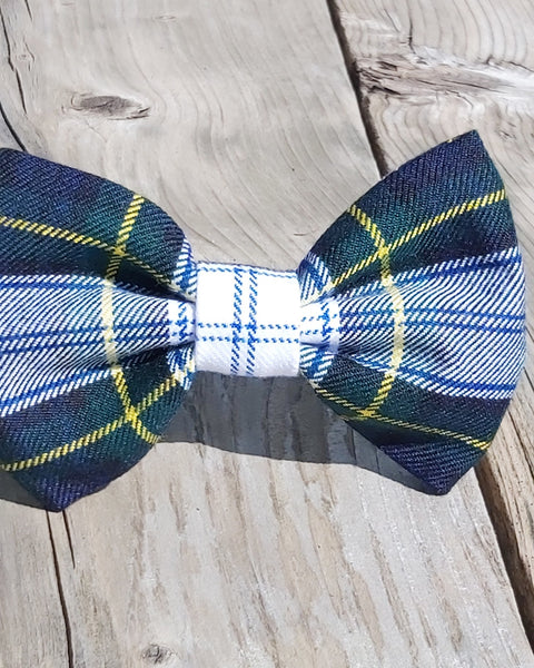 Navy Green and white plaid bow tie on a wooden surface