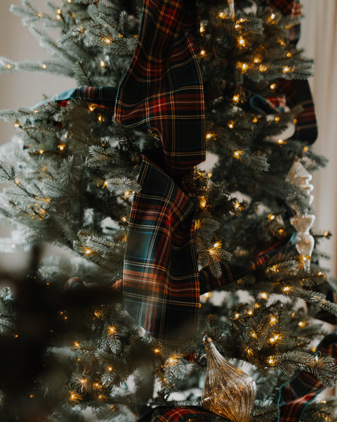 the tails of a green stewart tartan chirstmas tree bow