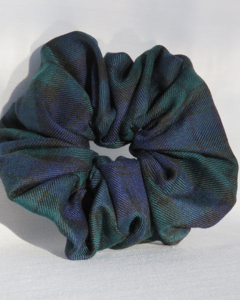 black watch tartan Plaid patterned scrunchie on a light gray background
