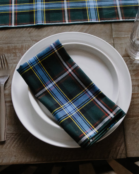 Labrador tartan napkin on a white plate sitting on a  wooden table