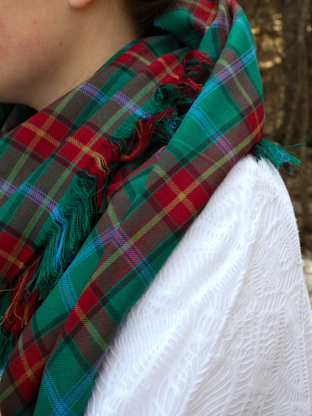 Close up of a Manitoba tartan red and green scarf