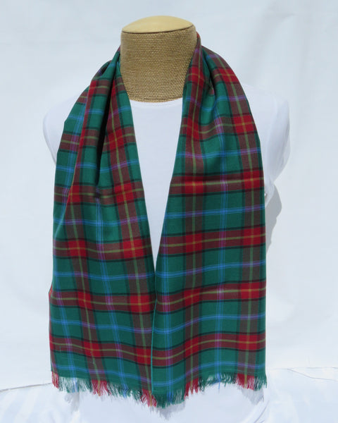 Green and red plaid scarf on a mannequin against a white background