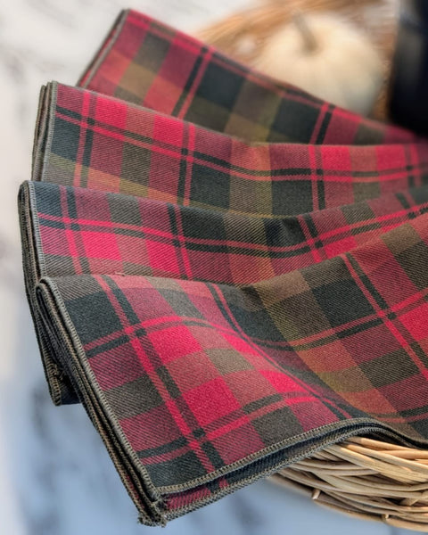 Canadian Maple Leaf tartan Plaid fabric with red, green, and brown colors on a light background