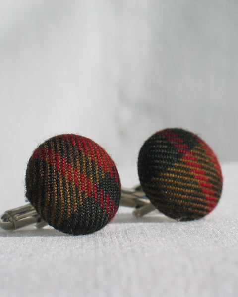 Canadian Maple leaf plaid patterned cufflinks on a white background