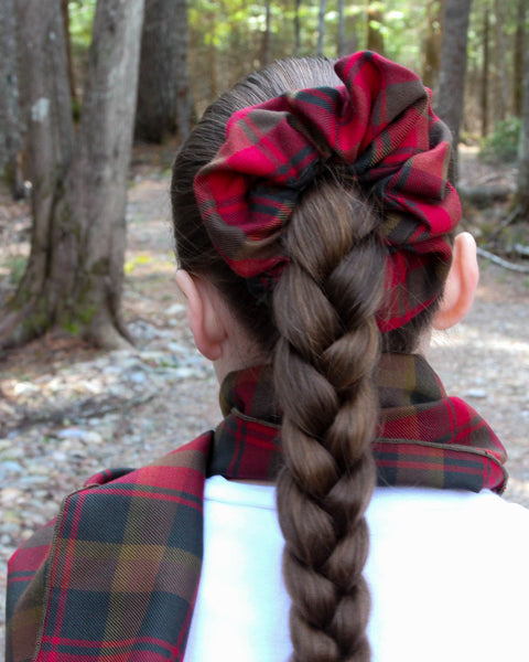 Canadian Maple Leaf tartan plaid scrunchie on a young girls braided hair with matching scarf in a forest setting