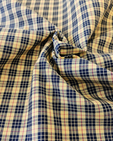 Close-up of checkered fabric with bright yellow and black pattern