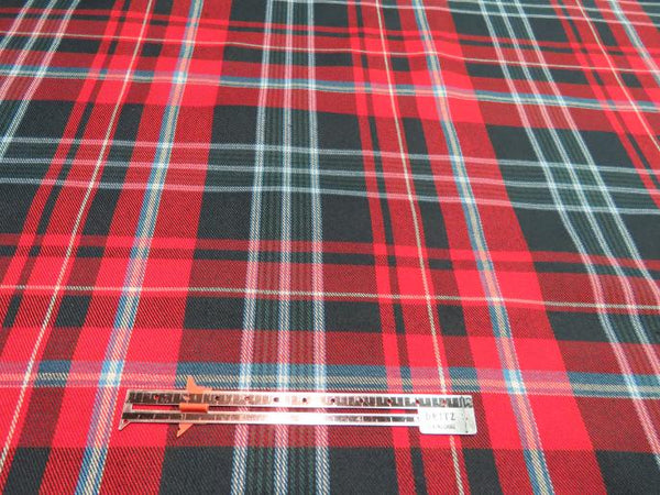 Red and green New Brunswick tartan fabric with a ruler for scale, sold by Taylors Tartans.
