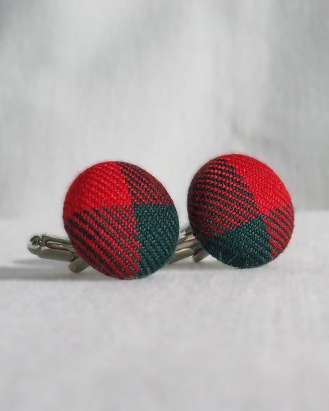Red and green plaid cufflinks on a white background in New Brunswick tartan