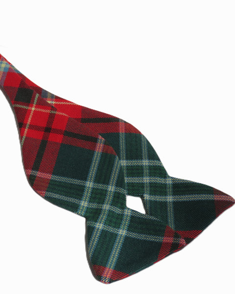 Plaid patterned freestyle bow tie in red, green, and black on a white background