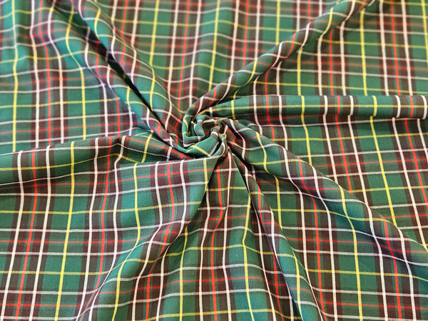 green, brown, yellow and white plaid cotton fabric crunched in the middle in Newfouondland tartan by Taylors Tartans