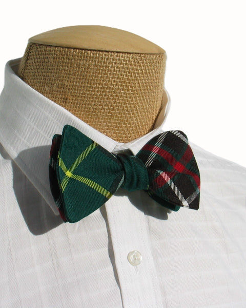 Green Newfoundland plaid bow tie on a mannequin torso with a white shirt