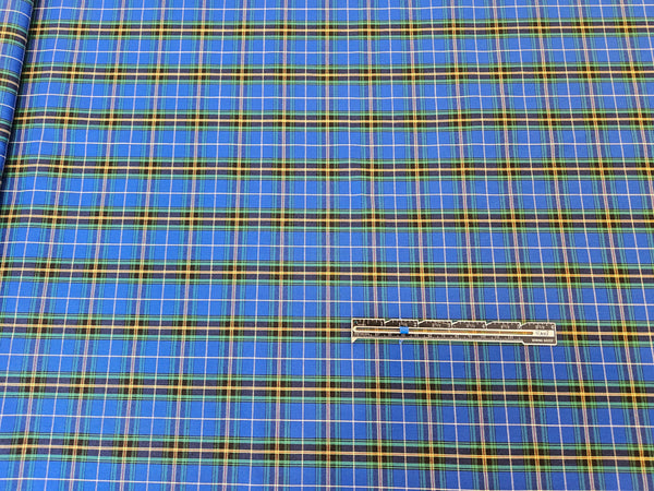Blue plaid cotton fabric with a runner for sizing on Nova Scotia tartan cotton fabric