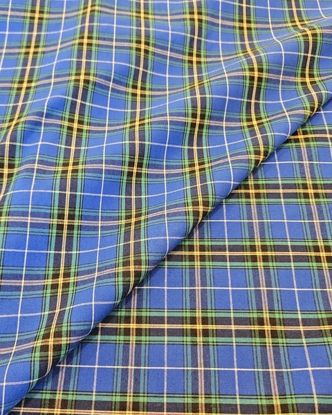 Royal blue, yellow, green and white plaid fabric folded Nova Scotia tartan cotton fabric