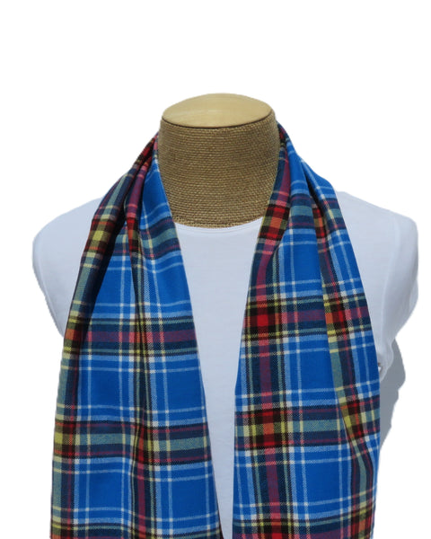 Blue plaid scarf on a mannequin with a white background