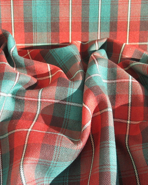rust and green plaid material scrunched in PEI tartan