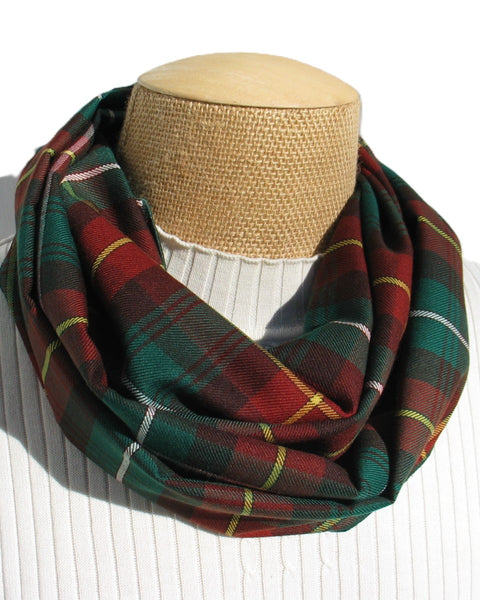 Rust-red, green white and yellow Plaid scarf on a mannequin bust against a white background
