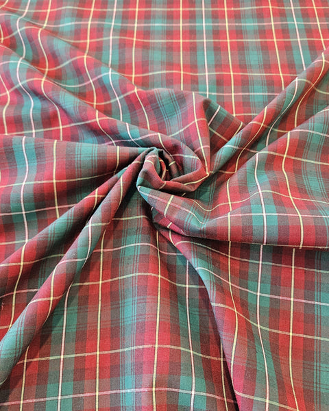Red and green plaid cotton in a swirl sold by Taylors Tartans