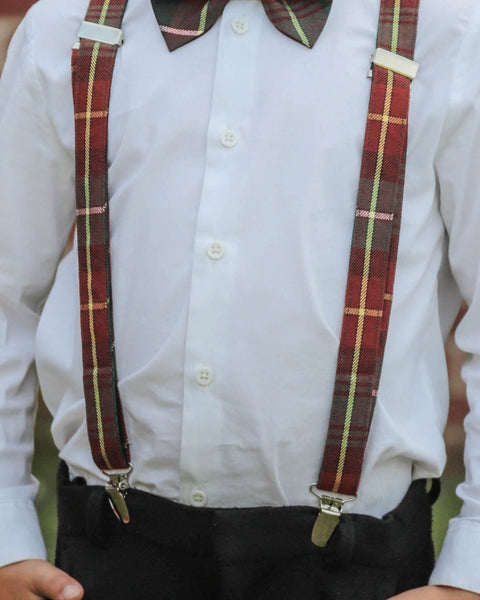 Close-up of a person wearing a white shirt with Prince Edward Island tartan plaid suspenders.