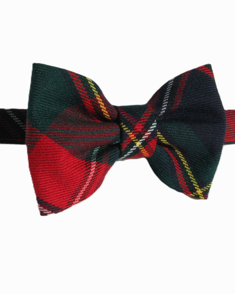 Quebec tartan plaid bow tie with red, green, and yellow pattern on a white background