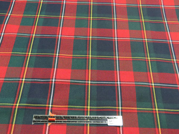 Plaid fabric with a measuring tape for scale on a red, green, and blue checkered pattern