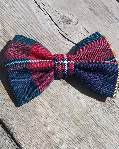 Navy and red plaid pet bow tie in Quebec tartan on old board
