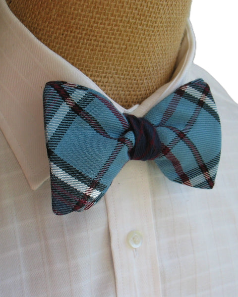 Royal Canadian Air Force plaid bow tie on a mannequin wearing a white shirt.
