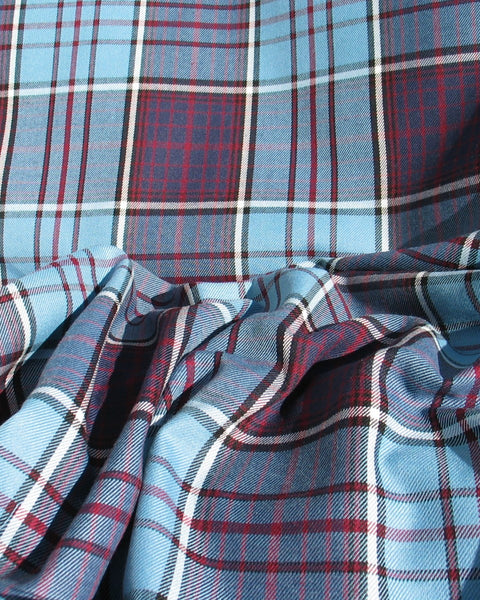 Blue, maroon, and white plaid fabric scrunched in RCAF Tartan