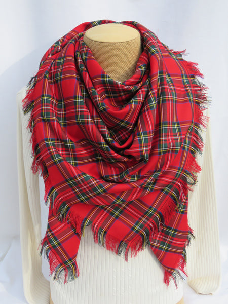 Red plaid scarf on a mannequin with a white background