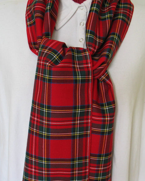 Red plaid scarf draped over a white manequin