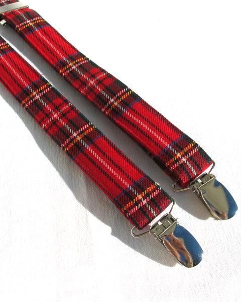 royal stewart tartan Red plaid suspenders with metal clips on a white background
