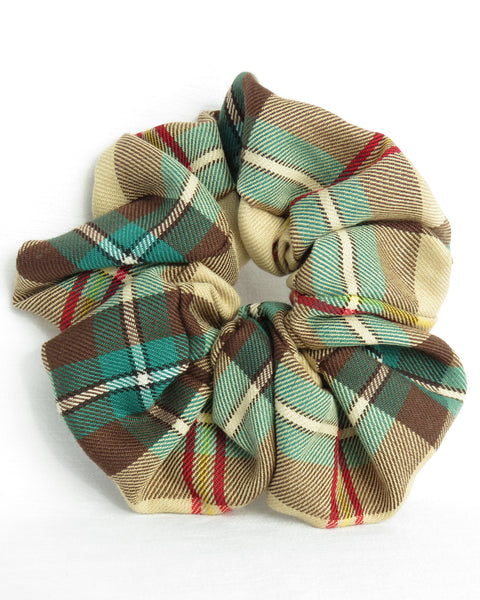 gold, brown, green, red, yellow, white, and black Saskatchewan tartan Plaid patterned scrunchies on a white background