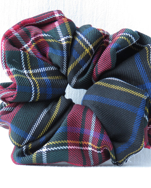 Black Stewart tartan Plaid patterned fabric in various colors on a white background