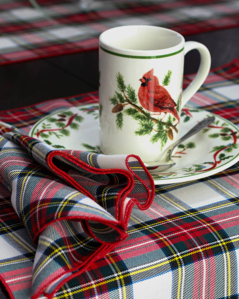 Mug with cardinal design on a Dress Stewartplaid table runner with matching plaid napkin