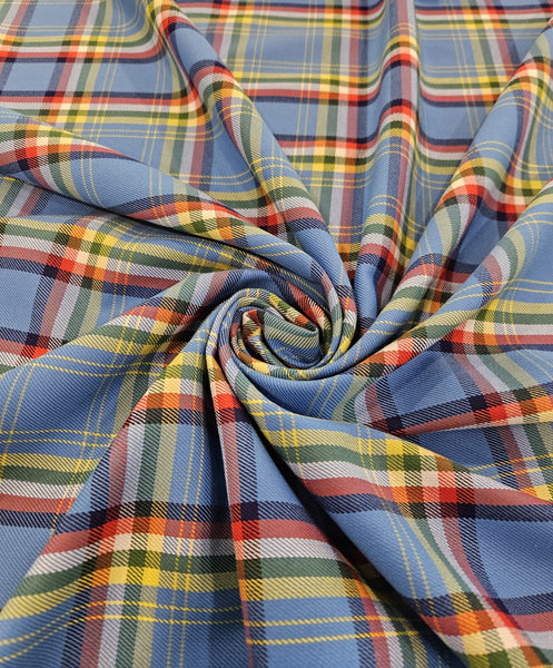 Close-up of plaid fabric with blue, red, and yellow pattern
