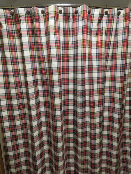 Plaid shower curtain with red, and white plaid pattern on a metal rod. Dress Stewart tartan shower curtain for Christmas